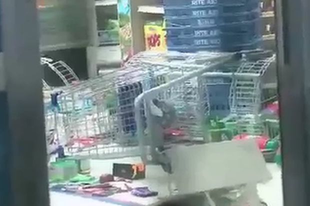 An overturned shopping cart at a Rite Aid, via WABC 7